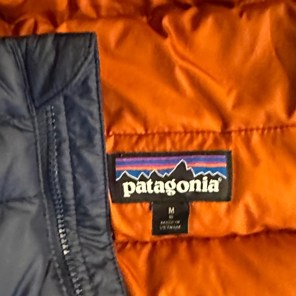 Patagonia Dark Blue Puffer Jacket with Bright Orange Interior - Picture 3 of 4